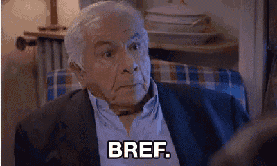 an elderly man in a suit is sitting in a chair and says bref .