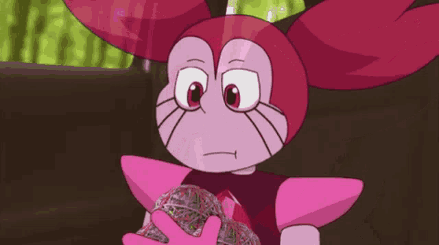 a pink cartoon character is holding a ball of money in her hands .