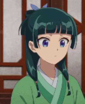 a girl with blue eyes and braids is wearing a green kimono and looking at the camera .