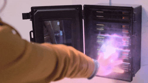 a person holding a purple object in front of a box that says ' thermostat ' on it
