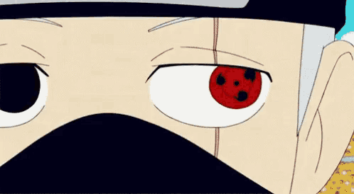 a close up of a cartoon character 's eyes with a red pupil