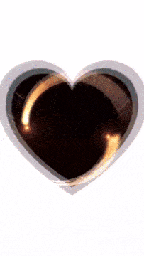 a heart with a light coming out of the center