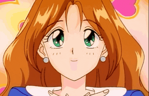 a close up of a girl 's face with green eyes