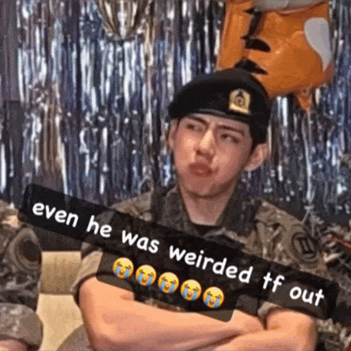 a man in a military uniform with a caption that says " even he was weirded tf out " on it