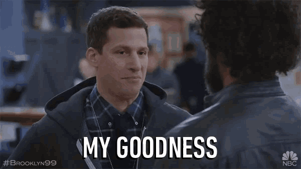 a man says my goodness to another man in a scene from brooklyn 99