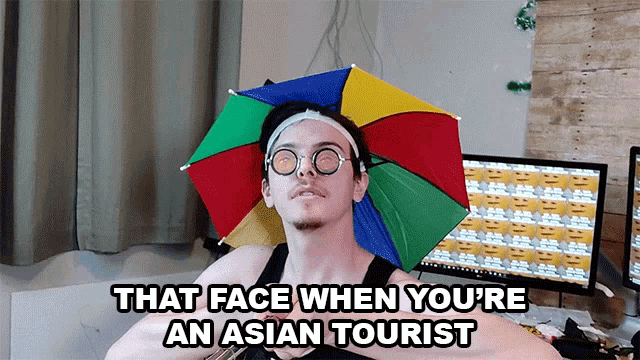 That Face When Youre An Asian Tourist Fake Glasses GIF - That Face When Youre An Asian Tourist Fake Glasses Umbrella Hat GIFs
