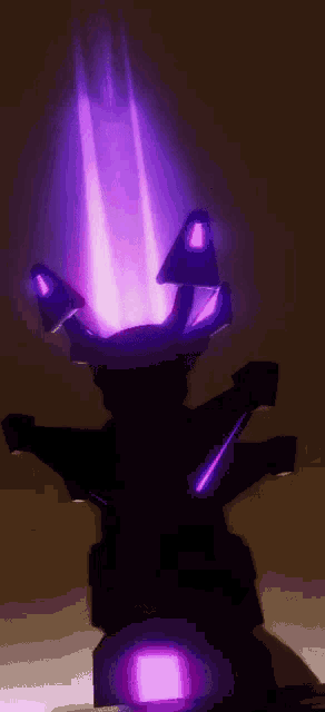 a purple light is coming out of the top of a dark object