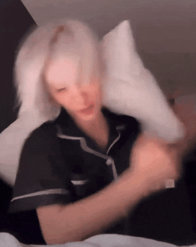 a blurry image of a person laying on a bed