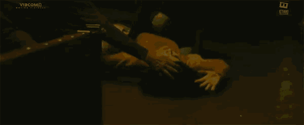 a person laying on the floor with a videocomb logo on the bottom right