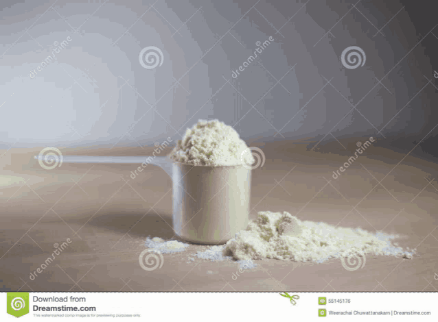 a scoop of powdered milk is on a table