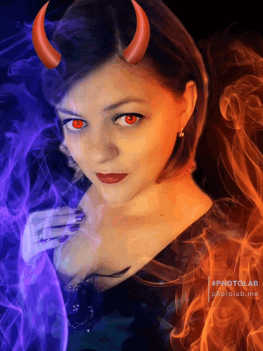 a woman with red eyes and devil horns is surrounded by fire