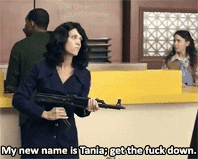 a woman is holding a gun and says " my new name is tania "