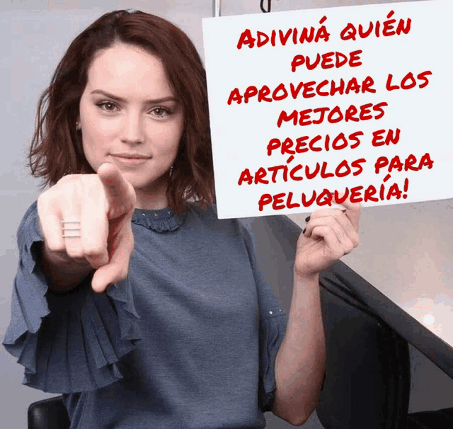 a woman holds up a sign that says adivina quien