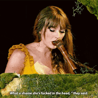 a woman singing into a microphone with the words " what a shame she 's fucked in the head "
