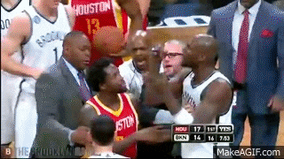 a group of basketball players are standing on a court and one of them is wearing a jersey that says houston .