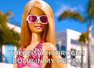 a barbie doll is wearing sunglasses and a bikini and says there 's a hydrogen bomb in my cooch