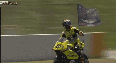 a man riding a motorcycle with the number 40 on the front