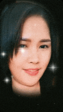 a close up of a woman 's face with stars around her