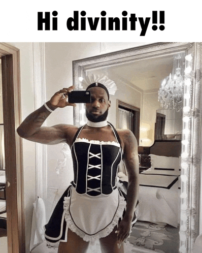 a man in a maid outfit is taking a selfie in front of a mirror