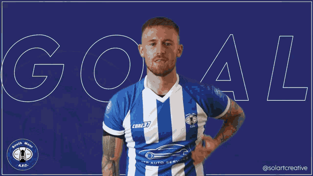 a man wearing a blue and white striped shirt with the word goal behind him