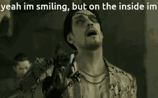 a man with an eye patch is smiling with a caption that says " yeah im smiling "