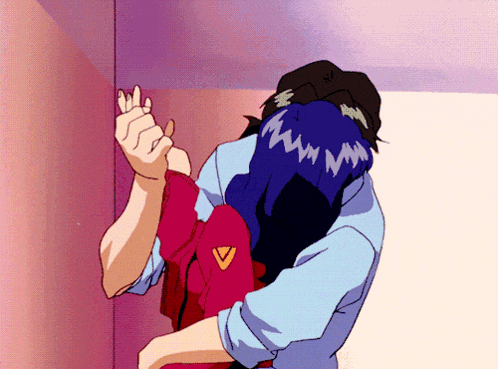 a man and a woman are hugging and the woman has a chevron on her jacket