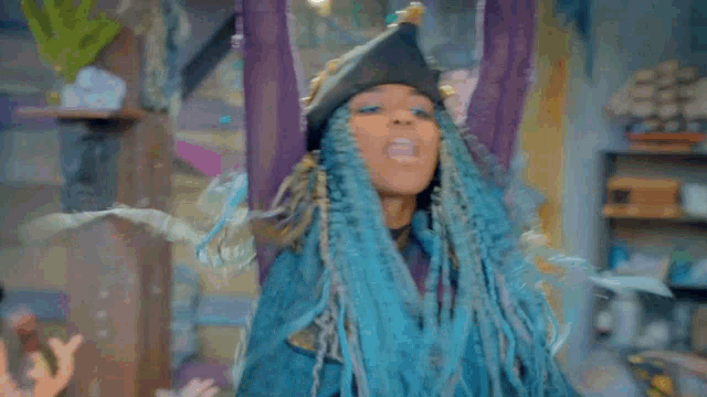 a woman in a pirate hat is holding a sword and hook .