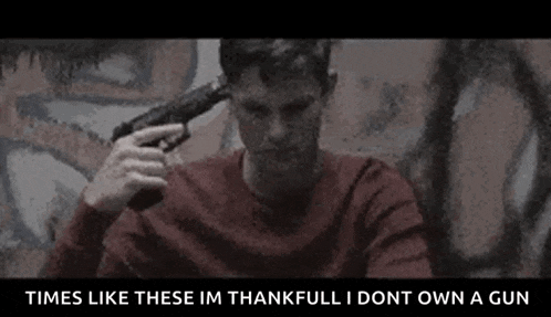 a man is holding a gun to his head and saying `` times like these im thankfull i dont own a gun '' .