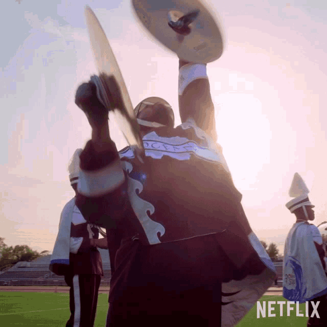 a netflix ad shows a man in a marching band holding a drum