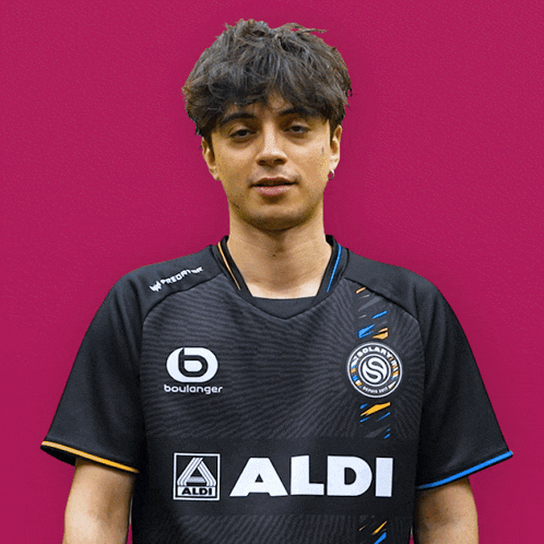 a man in a black shirt points his finger at the word ratio