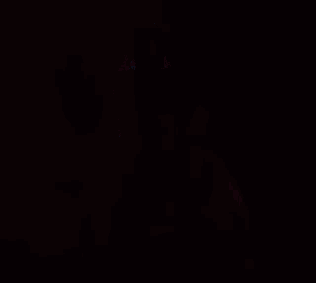 a girl in a white dress is clapping her hands in the air