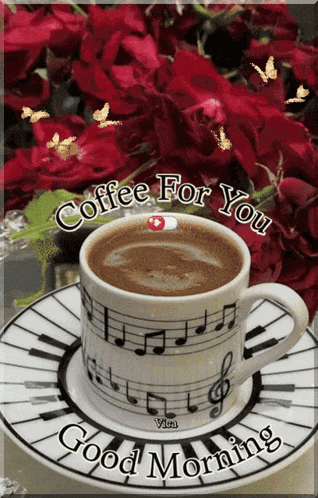 a cup of coffee sits on a saucer that says good morning