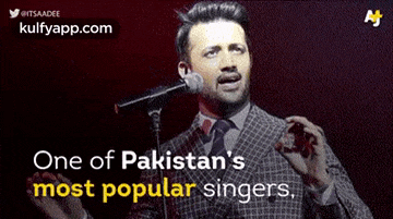 a man singing into a microphone with the words one of pakistan 's most popular singers above him