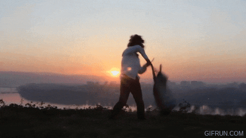 a gif from gifrun.com shows a woman holding a baby