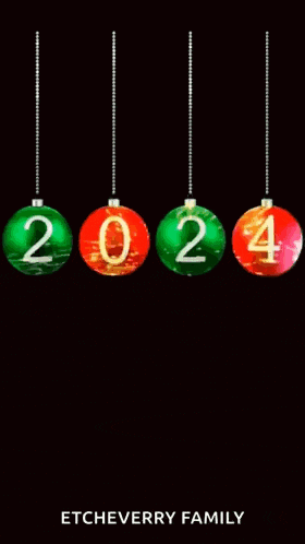 a happy new year greeting card with christmas balls hanging from a string