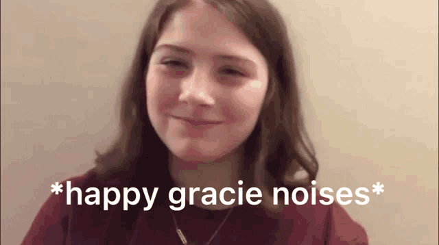 a young girl is smiling with the words happy gracie noises behind her