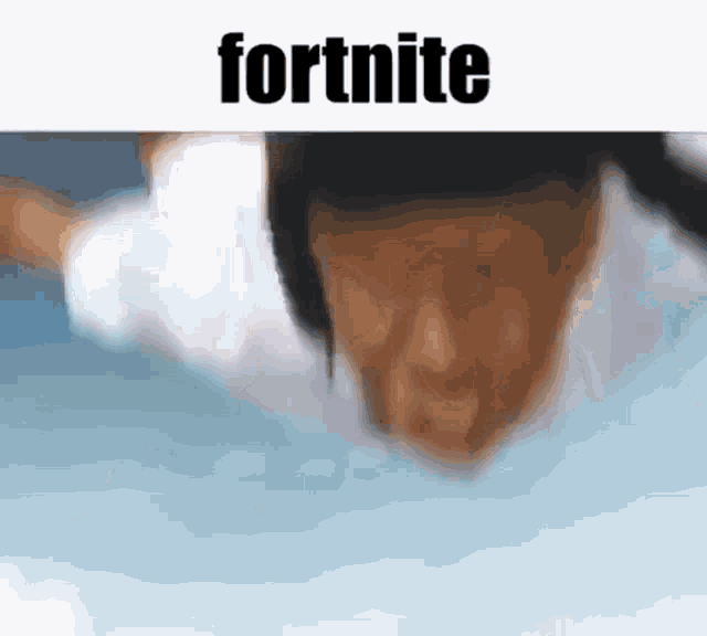 a blurry picture of a person flying through the air with the word fortnite written on the bottom .
