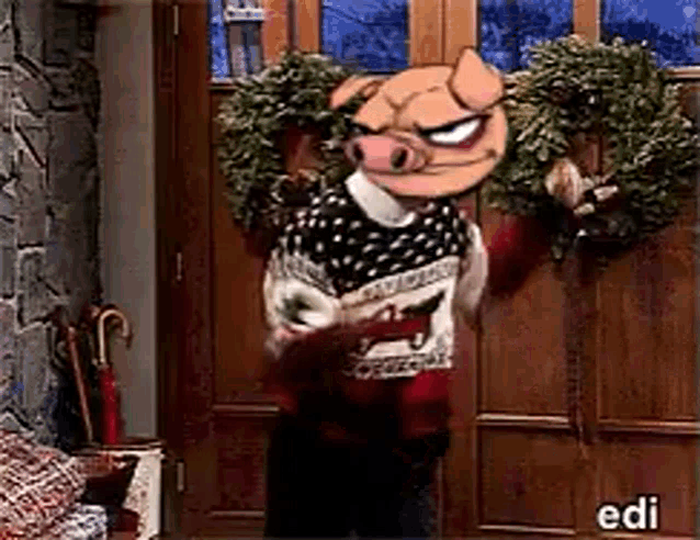 a pig wearing a sweater is holding a wreath in front of a door with edi written on it