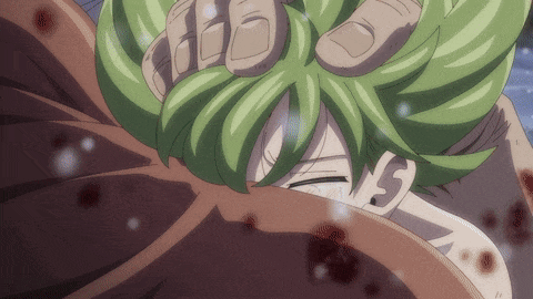 a cartoon character with green hair is being held by a hand