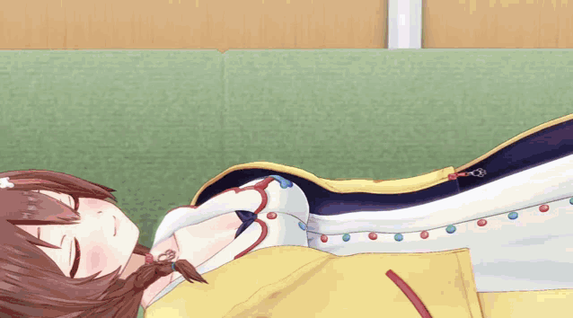 a cartoon girl is laying on a bed with a yellow blanket