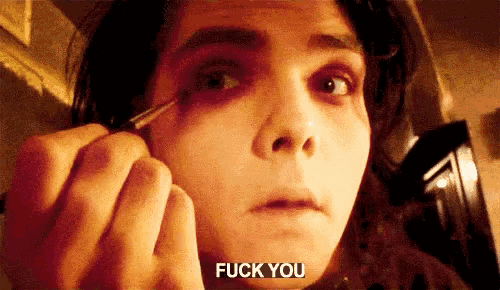 a close up of a person applying makeup with the words " fuck you " on the bottom