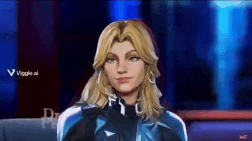a woman with blonde hair is sitting in front of a screen that says viggle.ai ..