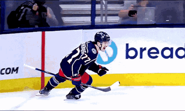a hockey player wearing a number 27 jersey