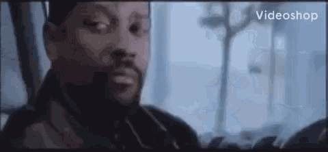 a close up of a man 's face in a movie scene .