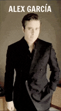 a man in a suit is standing with his hands in his pockets and the name alex garcia is above him