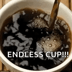 a cup of coffee is being poured into a cup on a table .