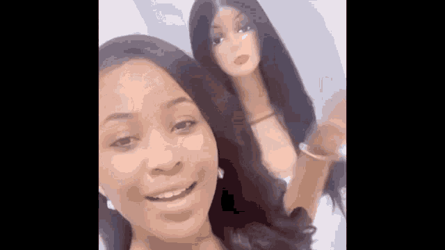 two women are standing next to each other with wigs on their faces .