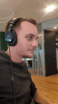 a man wearing a pair of headphones that say sony on them