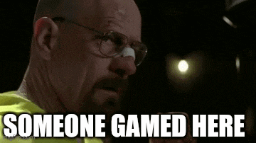 a man with glasses and a bandage on his nose says `` someone gamed here '' while holding a cell phone .