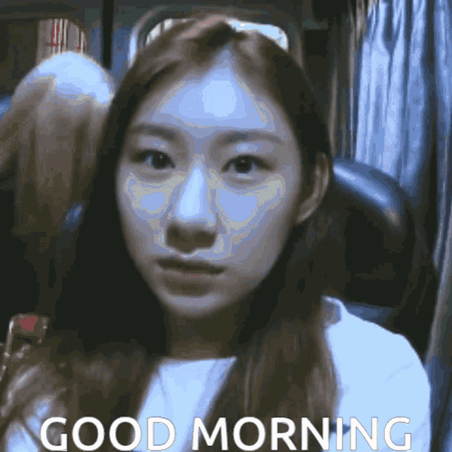 a woman sitting in a chair with the words " good morning " on the bottom